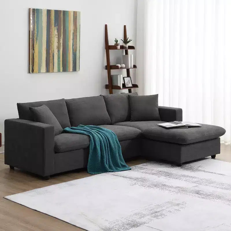 Divano sezionale a L in tessuto 101 con pouf