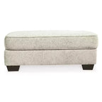 Pouf ottomano rivestito in ciniglia color sabbia per soggiorno