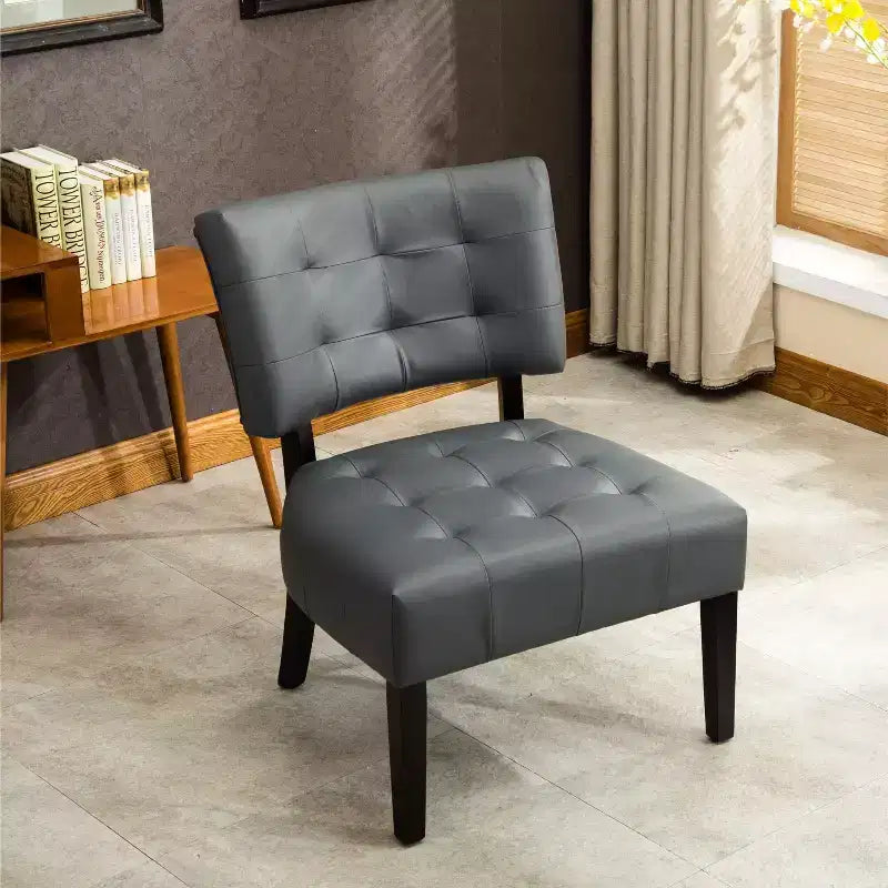 Poltrona di design Okak moderna, poltrona trapuntata in bouclé Movile con seduta oversize per soggiorno, camera da letto, appartamento