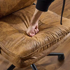 Fauteuil de bureau pivotant noir en cuir imitation chat avec points de tirage, dossier dissimulable et clous