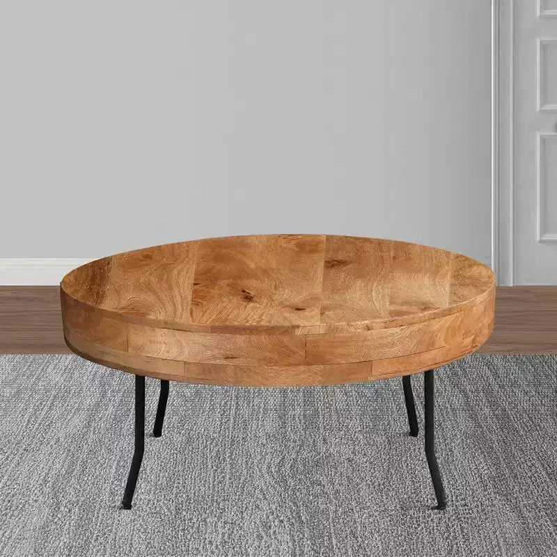 Tavolino Royal Hampton in legno di mango lavorato a mano, piano rotondo, gambe angolate in metallo nero, 81 cm -