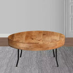 Tavolino Royal Hampton in legno di mango lavorato a mano, piano rotondo, gambe angolate in metallo nero, 81 cm -