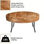 Tavolino Royal Hampton in legno di mango lavorato a mano, piano rotondo, gambe angolate in metallo nero, 81 cm -