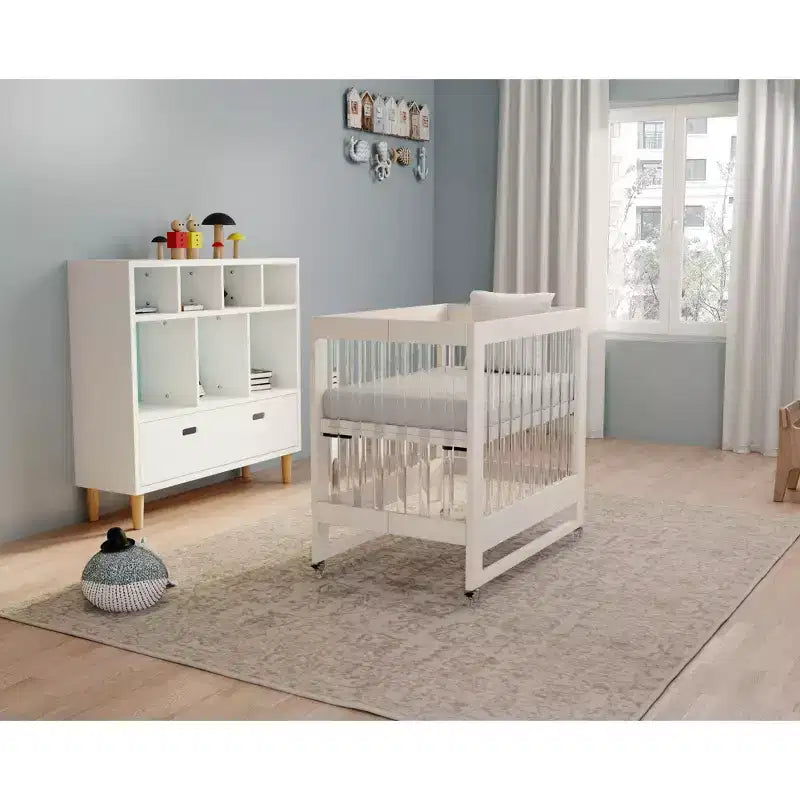 MelO Caress Foldable Crib, Modern Acrylic Frame with 4 Height Levels, Smooth Wheels & Easy Folding Design  Washed White