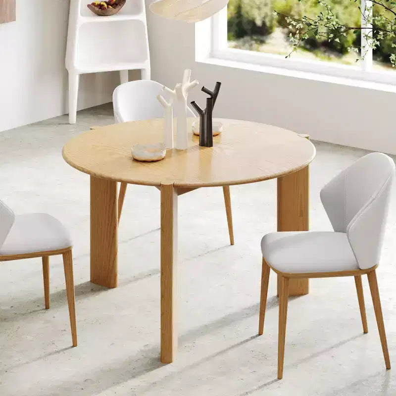 Tavolo da pranzo rustico in legno massello con piano rotondo effetto legno e base a croce per sale da pranzo moderne e riunioni di famiglia